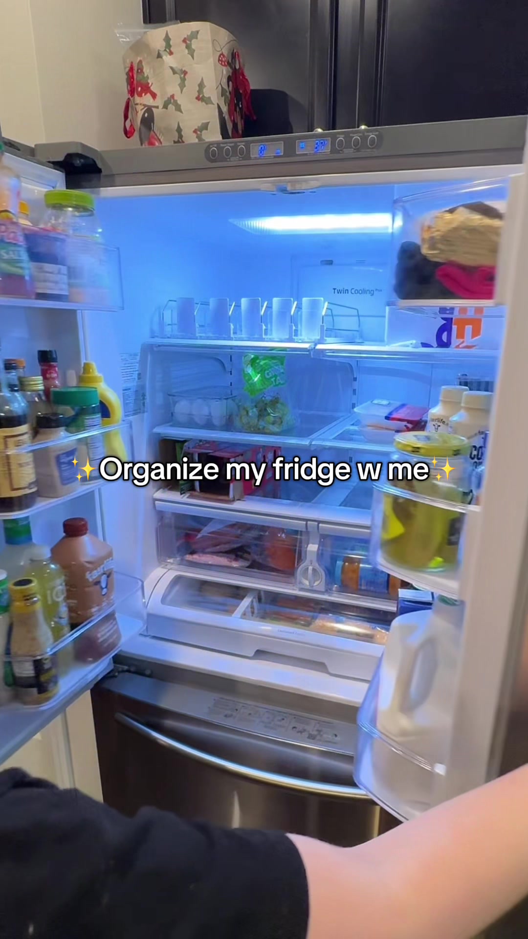 TikTok post by @_mariclaremaclamroc_ for vitaminwater. Caption reads: Restocked the fridge with all my faves 🧃✨ but....