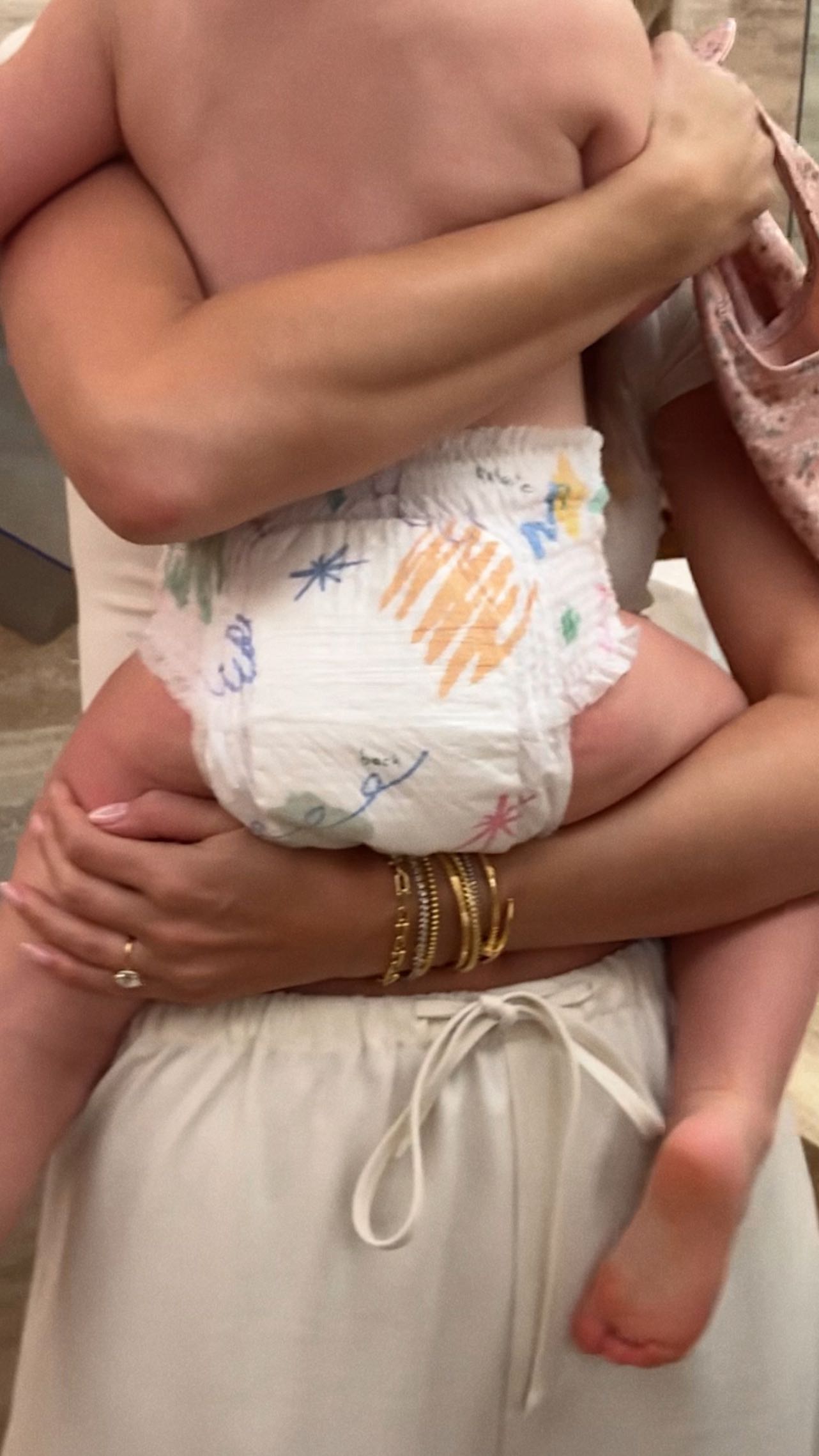 Instagram post by @katelove for Coterie. Caption reads: Loving the @coterie swimsuit diaper for our swim....