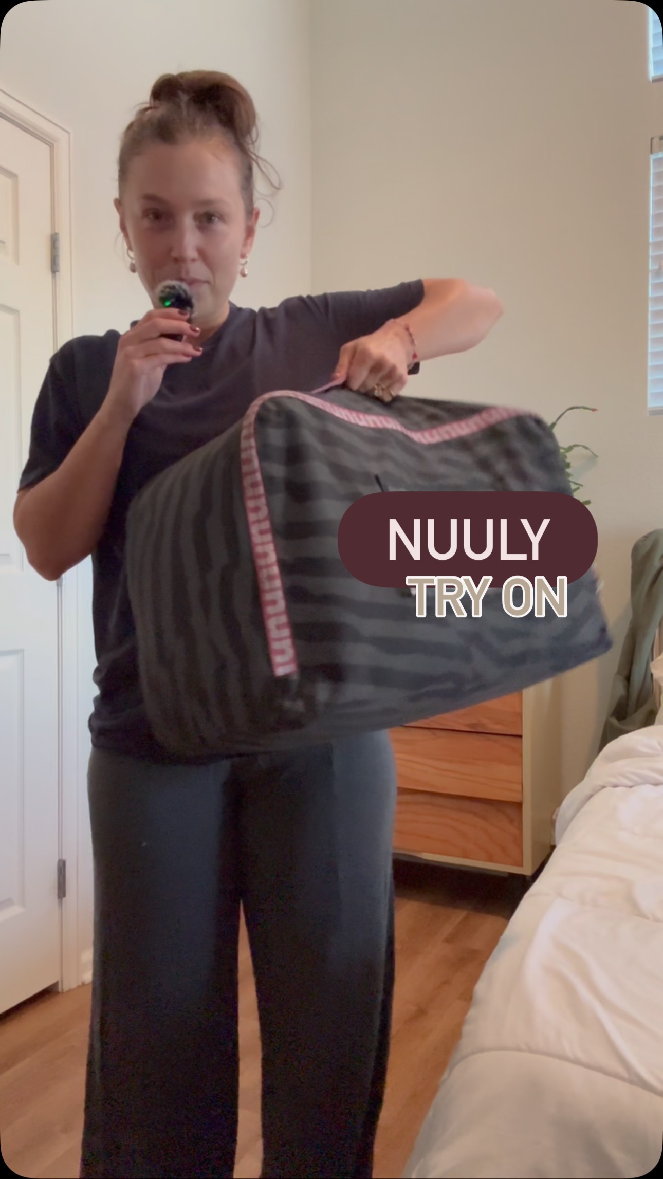 Instagram post by @nicole_mejia for Nuuly. Caption reads: Birthday Nuuly Box unboxing and try on! 🤎

Is....