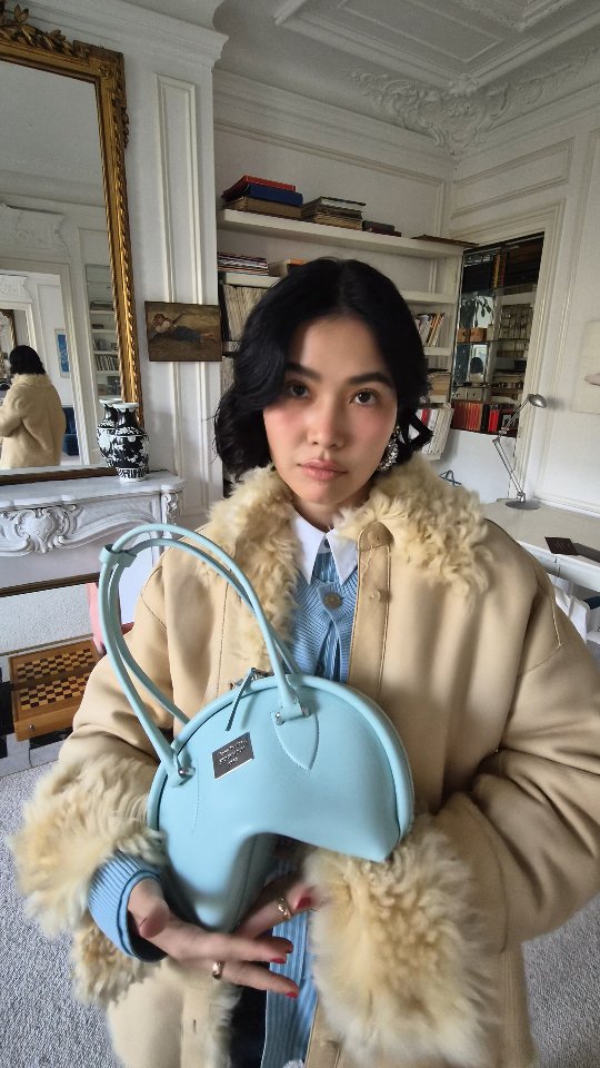 Instagram post by @proud_olives for Acne Studios. Caption reads: Let's get ready for @acnestudios show 🎀💫.