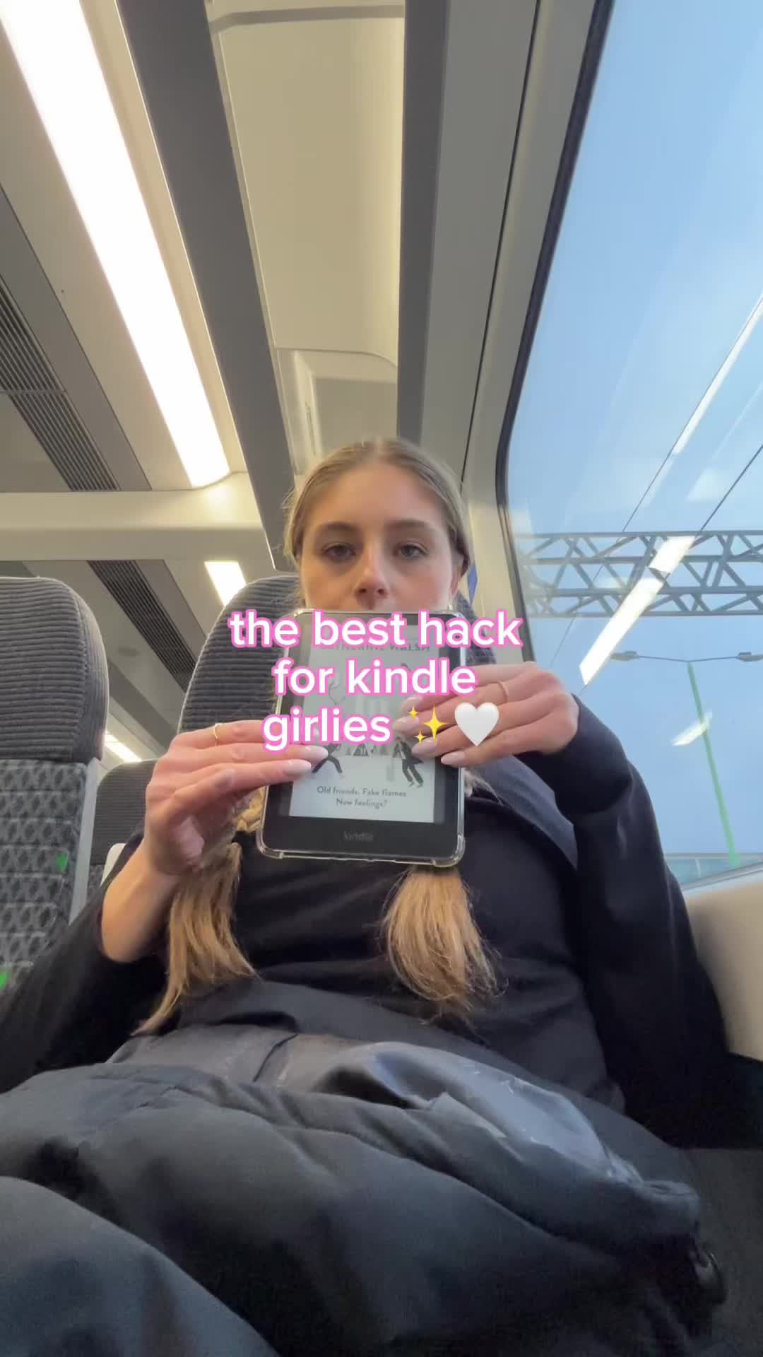 TikTok post by @kelseysreadingg for Strapsicle. Caption reads: [...] on the train 🚆 these straps from....
