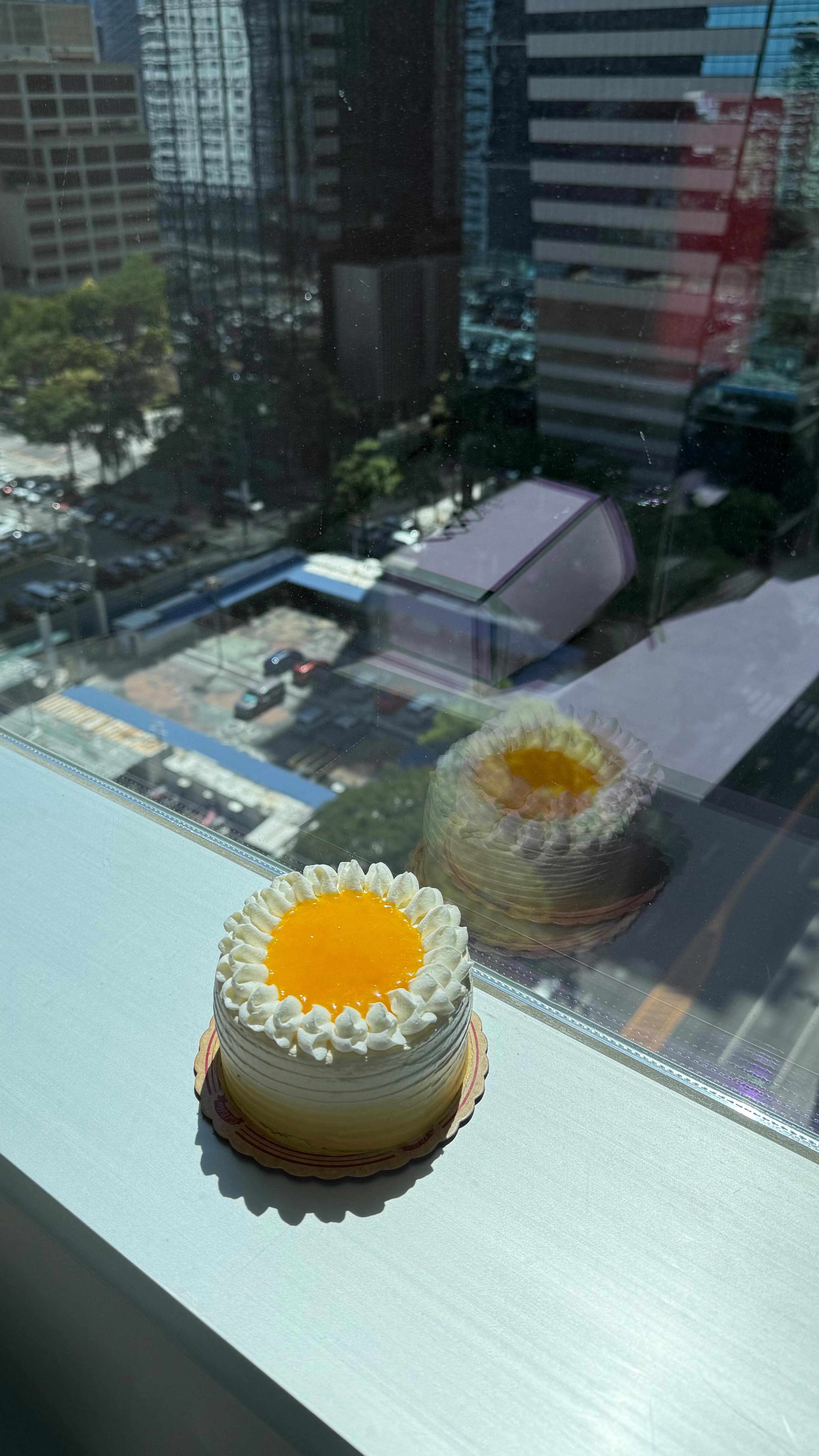 Instagram post by @kayeorpilla for Red Ribbon Bakeshop. Caption reads: A slice of summer in full bloom. 🌻 Try Red....