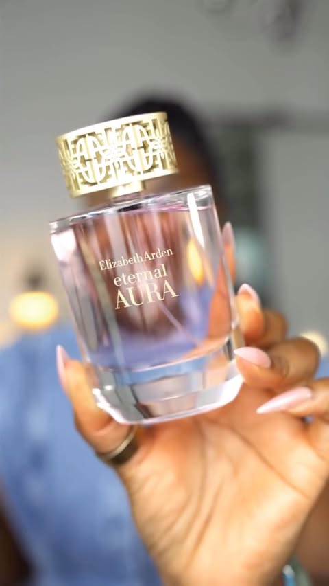 Instagram post by @mena_adubea for Elizabeth Arden. Caption reads: Eternal Aura by Elizabeth Arden is a beautiful....