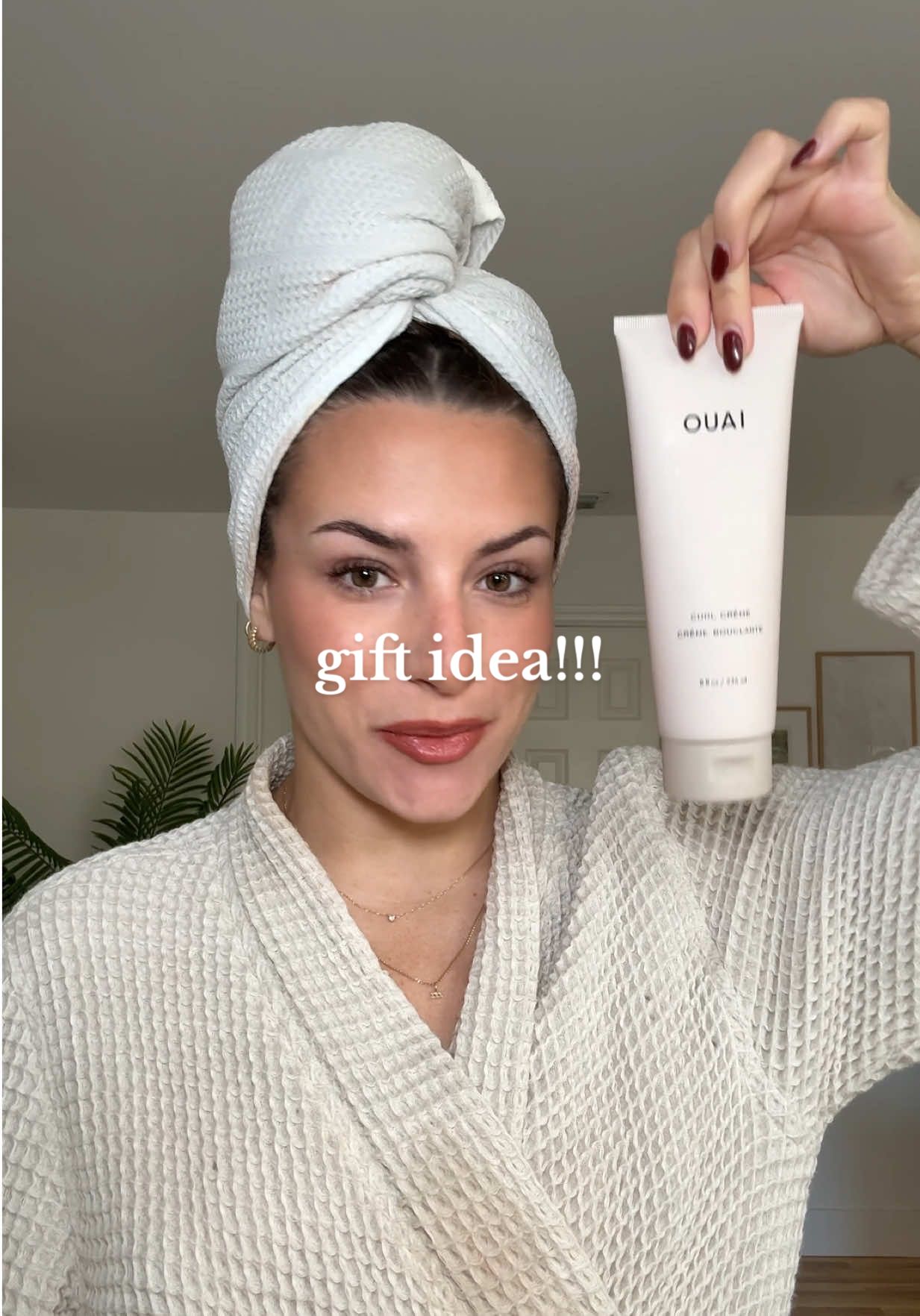 TikTok post by @itsmarinaann for OUAI. Caption reads: stock up on @THE OUAI Curl Crème now on TikTok....