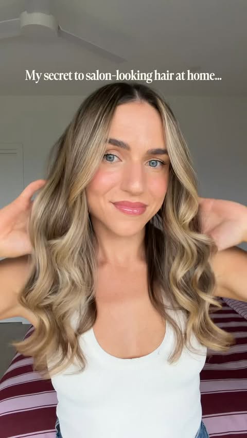Instagram post by @caitlin.munyard for John Frieda US. Caption reads: Good hair days start here 💁🏼‍♀️🫧💜✨ When I....