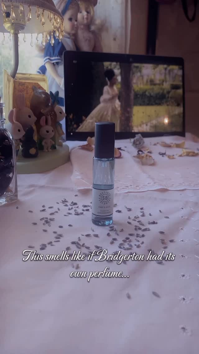 Instagram post by @zellayounce for Shay & Blue. Caption reads: Lilacs & Gooseberries by @shayandblue 🪻🧚🏻‍♂️....