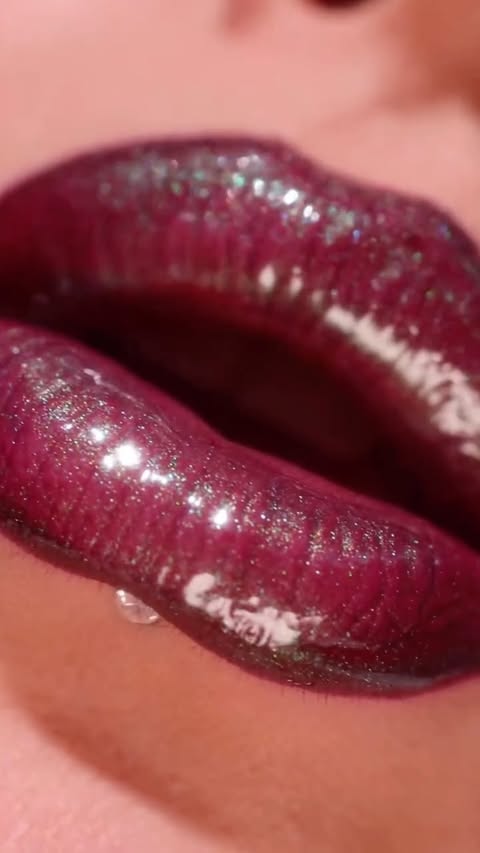 Instagram post by @eveemax for Overskin. Caption reads: [...] you guys see such a gloss? 🤩 Gorgeous shade....