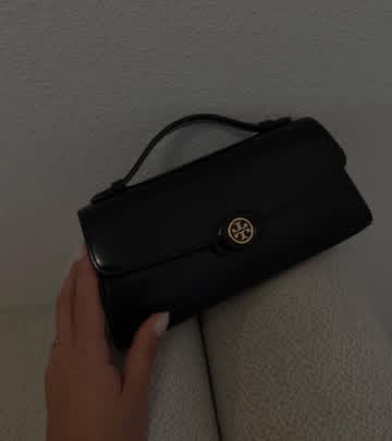 Instagram post by @meysaeylul for collAble. Caption reads: 🖤
Link in bio
#toryburch #collablecreator....