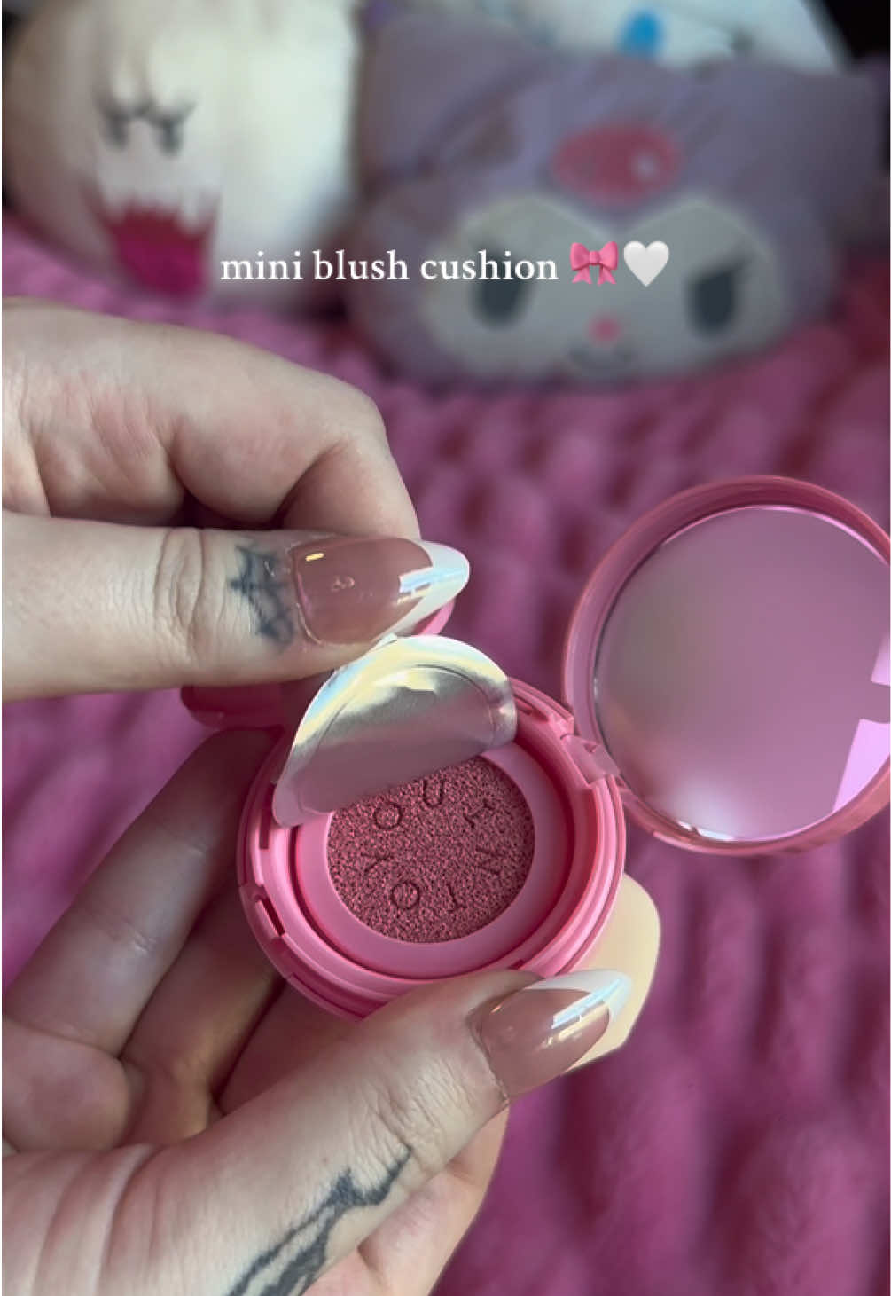 TikTok post by @kotamew for INTO YOU. Caption reads: @intoyoucosmetics has the cutest little cushion....