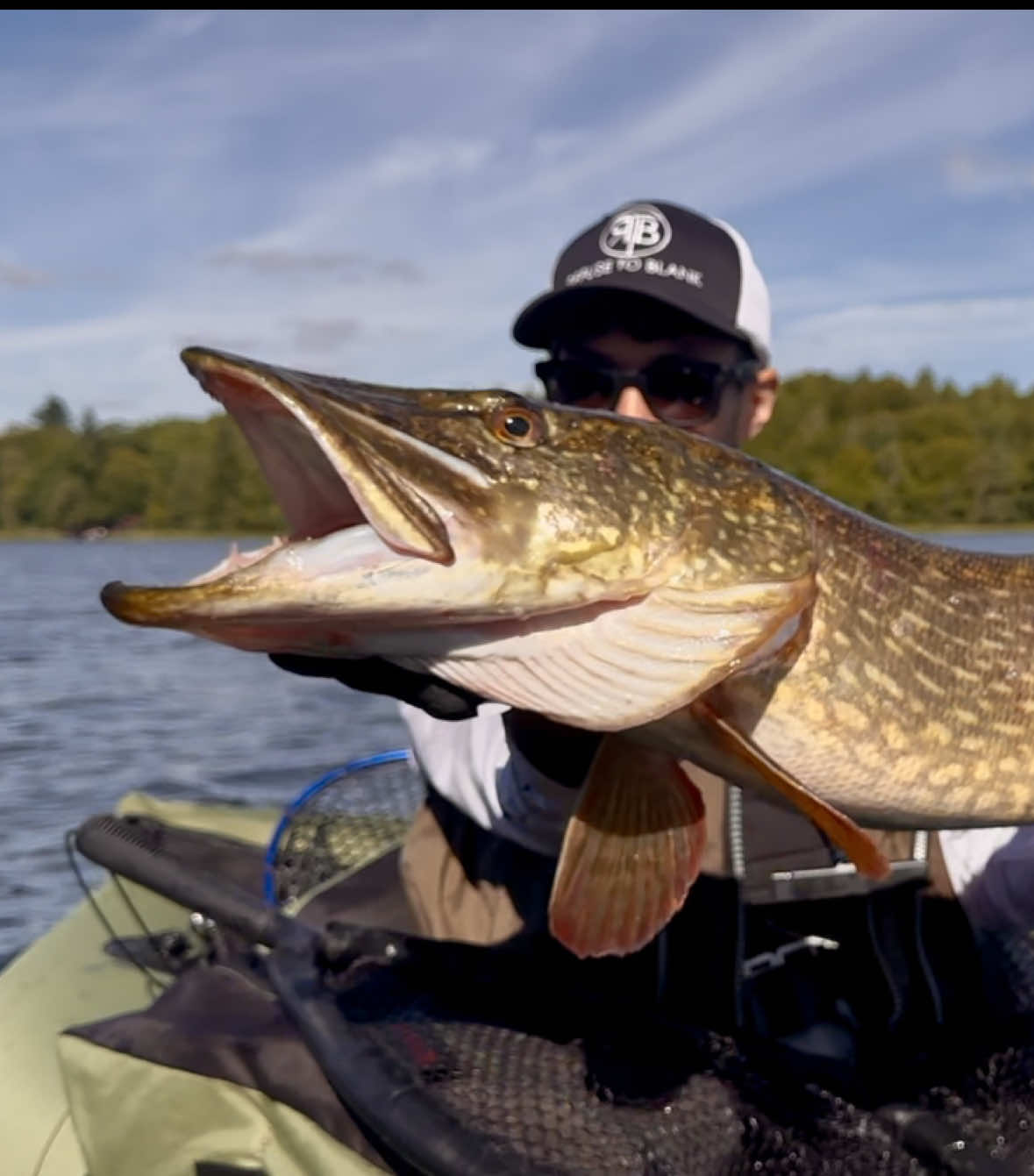 TikTok post by @barbless.balage for Deepersonar. Caption reads: Huge Pike from the Belly Boat!! 🎣🌕 Full moon....