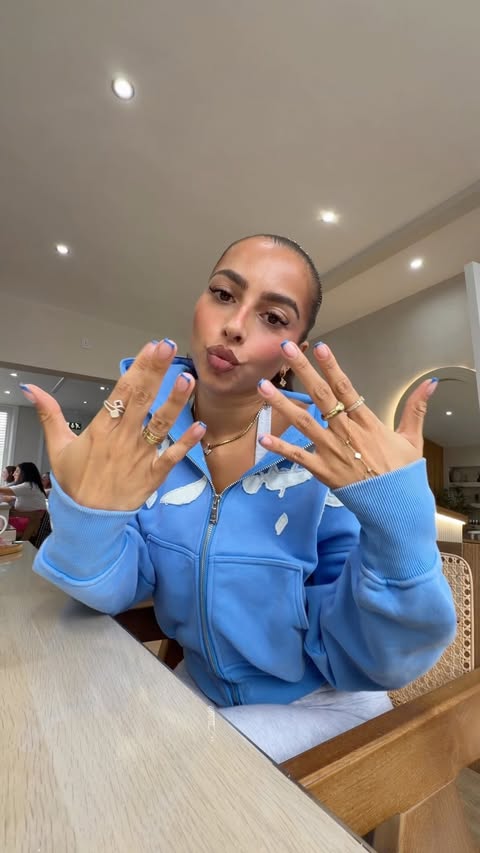 Instagram post by @miakhannn for OPI. Caption reads: [...] She got some blue going onnn🥣🫐💙🩴💅🏽....