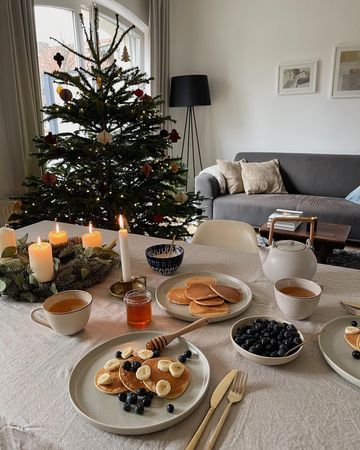 Instagram post by @zlataapetrenko for MADE.COM. Caption reads: happy third advent! 🌲✨🍊⁣ having pancakes for....