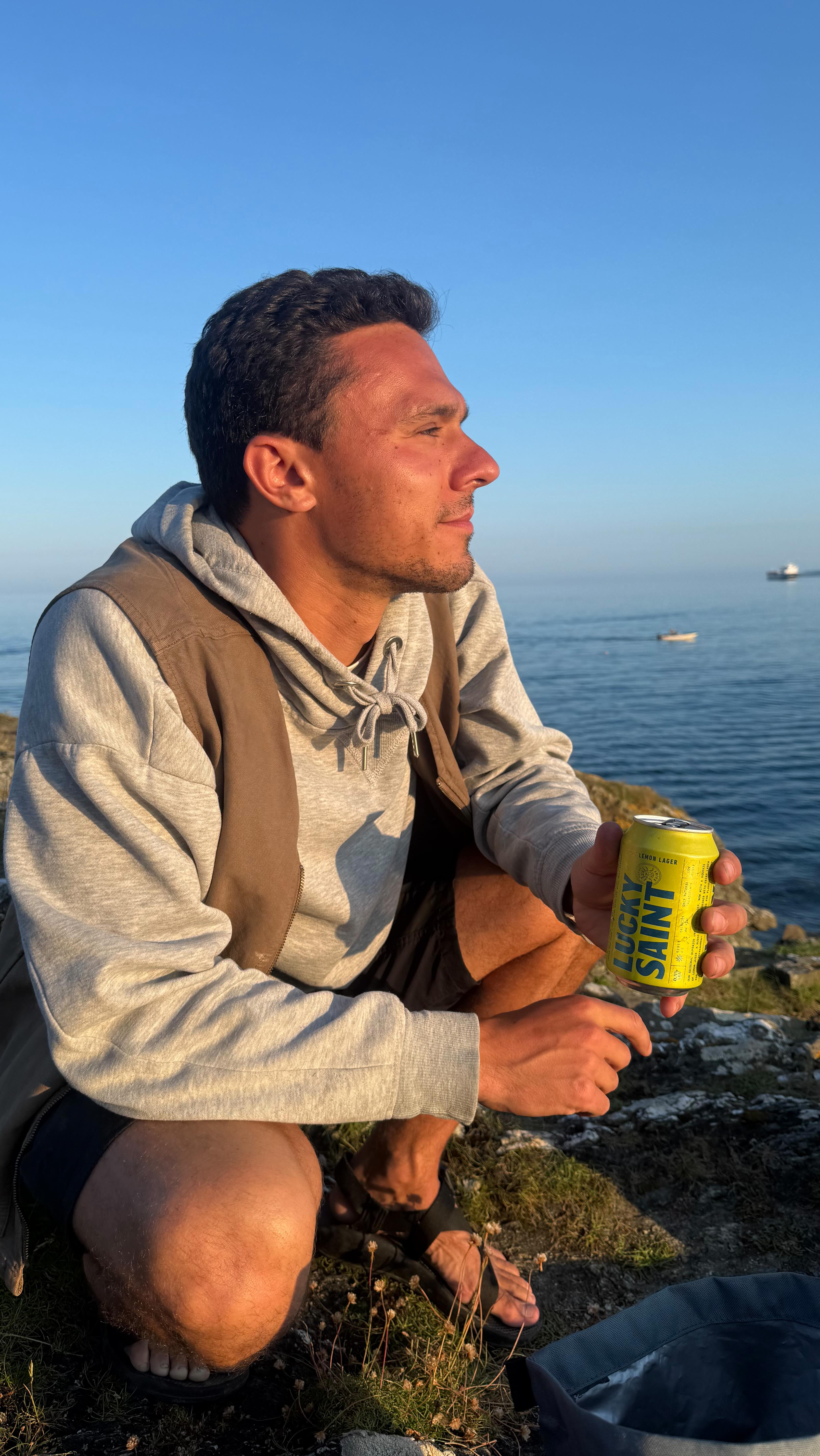 Instagram post by @tomsparrowoutdoors for Lucky Saint. Caption reads: ad Summer rituals with @luckysaintbeer.