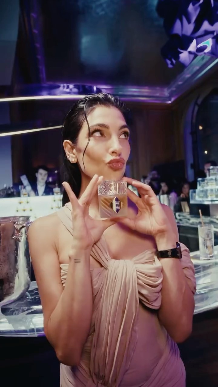Instagram post by @annanooshin for KILIAN PARIS. Caption reads: Celebrating Angels’ Share on the Rocks with....
