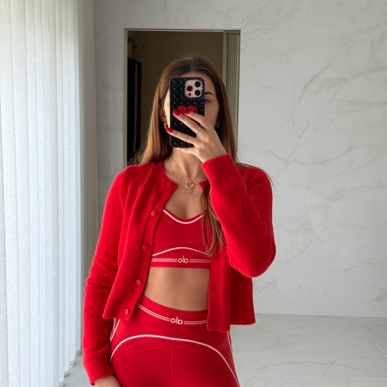 Instagram post by @sasha__rebecca for Alo Yoga. Caption reads: It really is the most wonderful time....