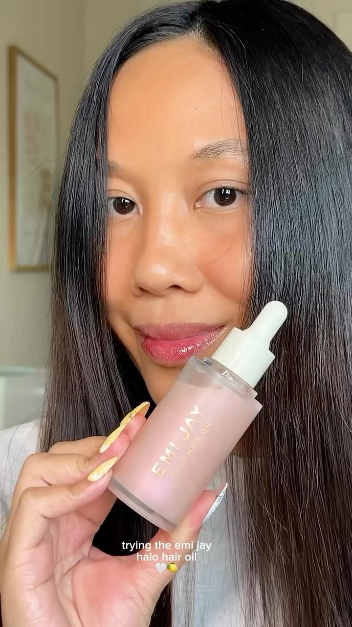 Instagram post by @pinaydora for Emi Jay. Caption reads: trying the halo hair oil from @emijayinc the last....