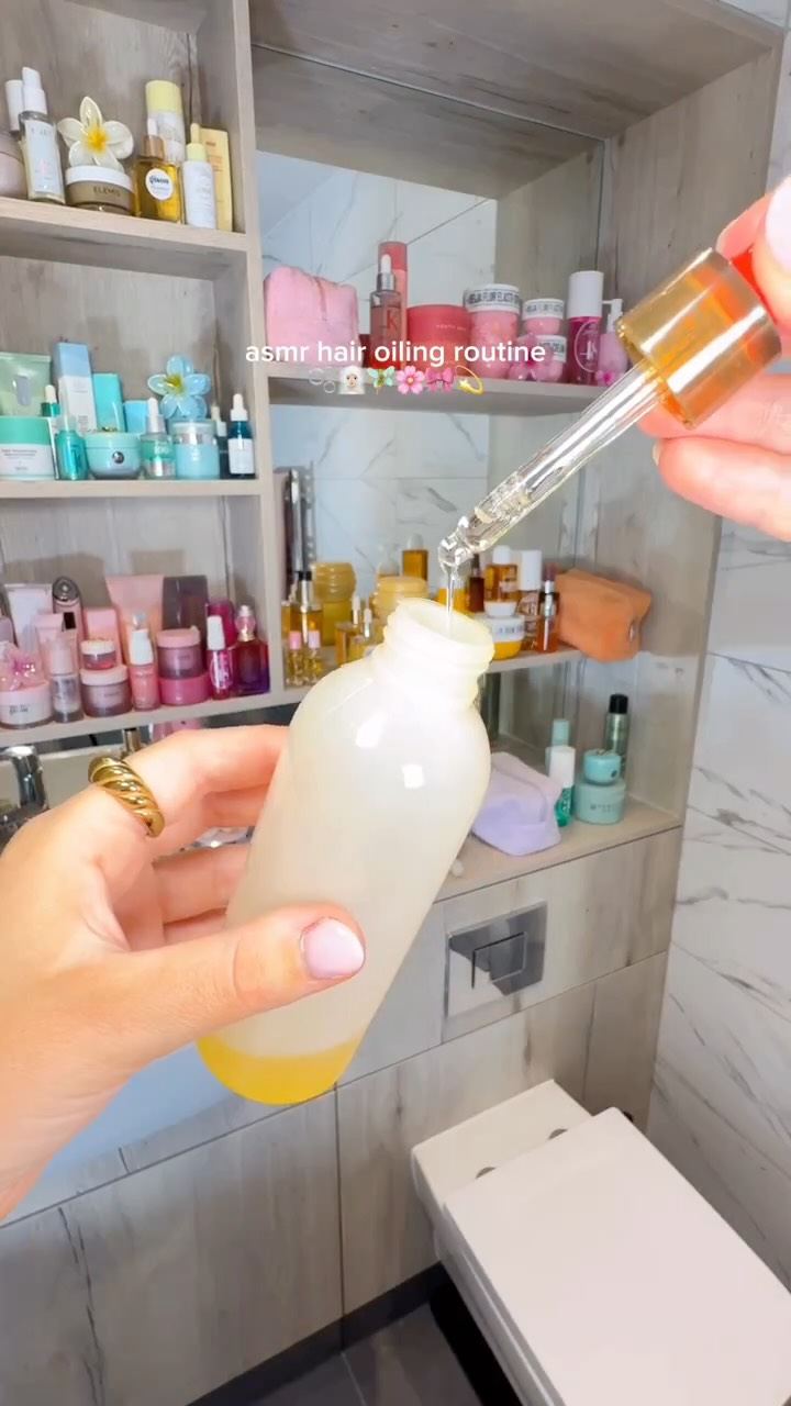 Instagram post by @byemmaleah for Gisou. Caption reads: asmr weekly hair oiling routine for hair growth....