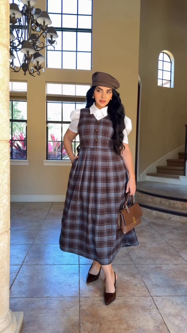 Instagram post by @xmyraboss for Simple Retro. Caption reads: 1 or 2? @simpleretro ✨ -KINLEY V-NECK PLAID DRESS....