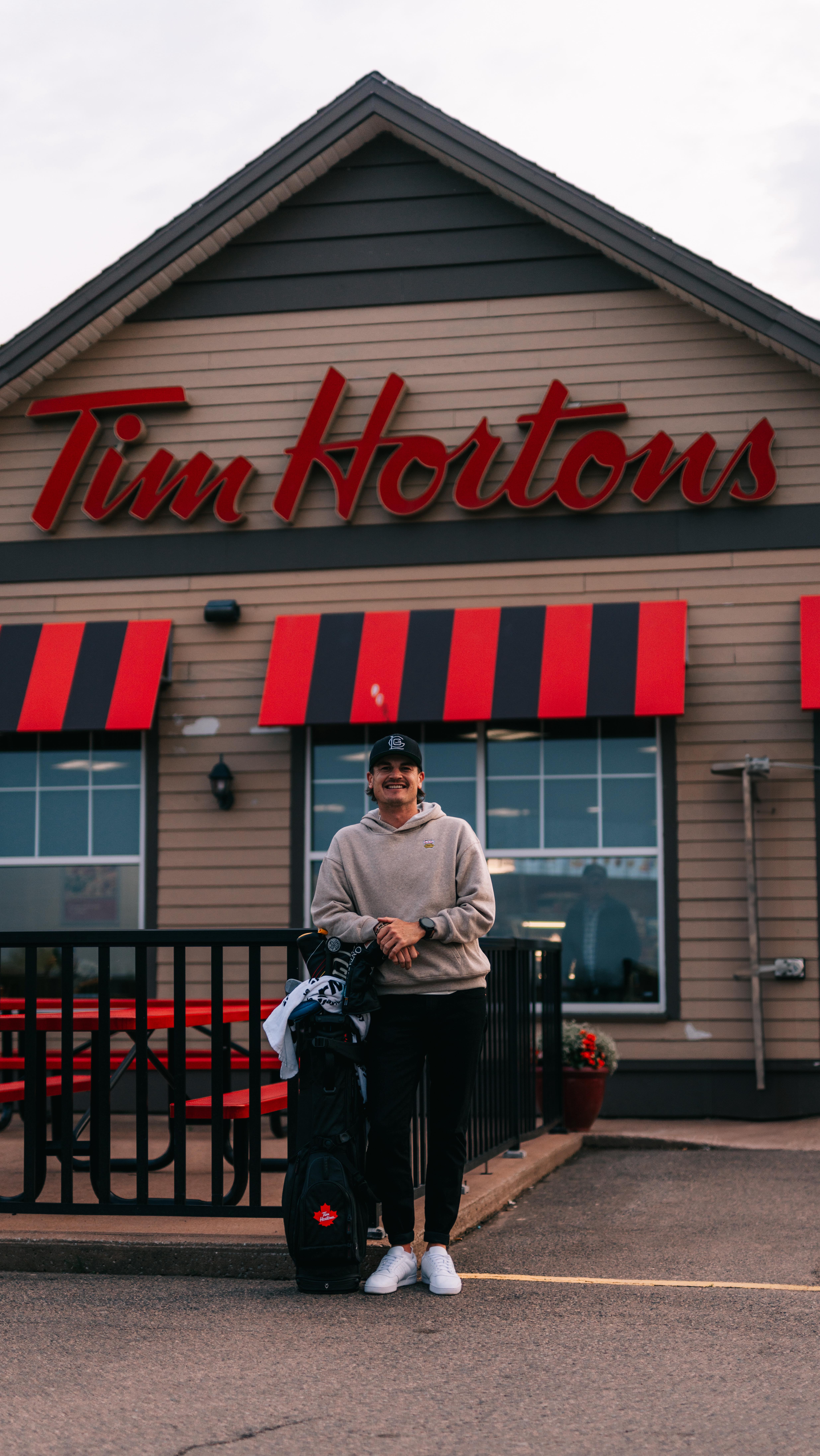 Instagram post by @macbouchergolf for Tim Hortons. Caption reads: Let’s help build a better future for Canadian....