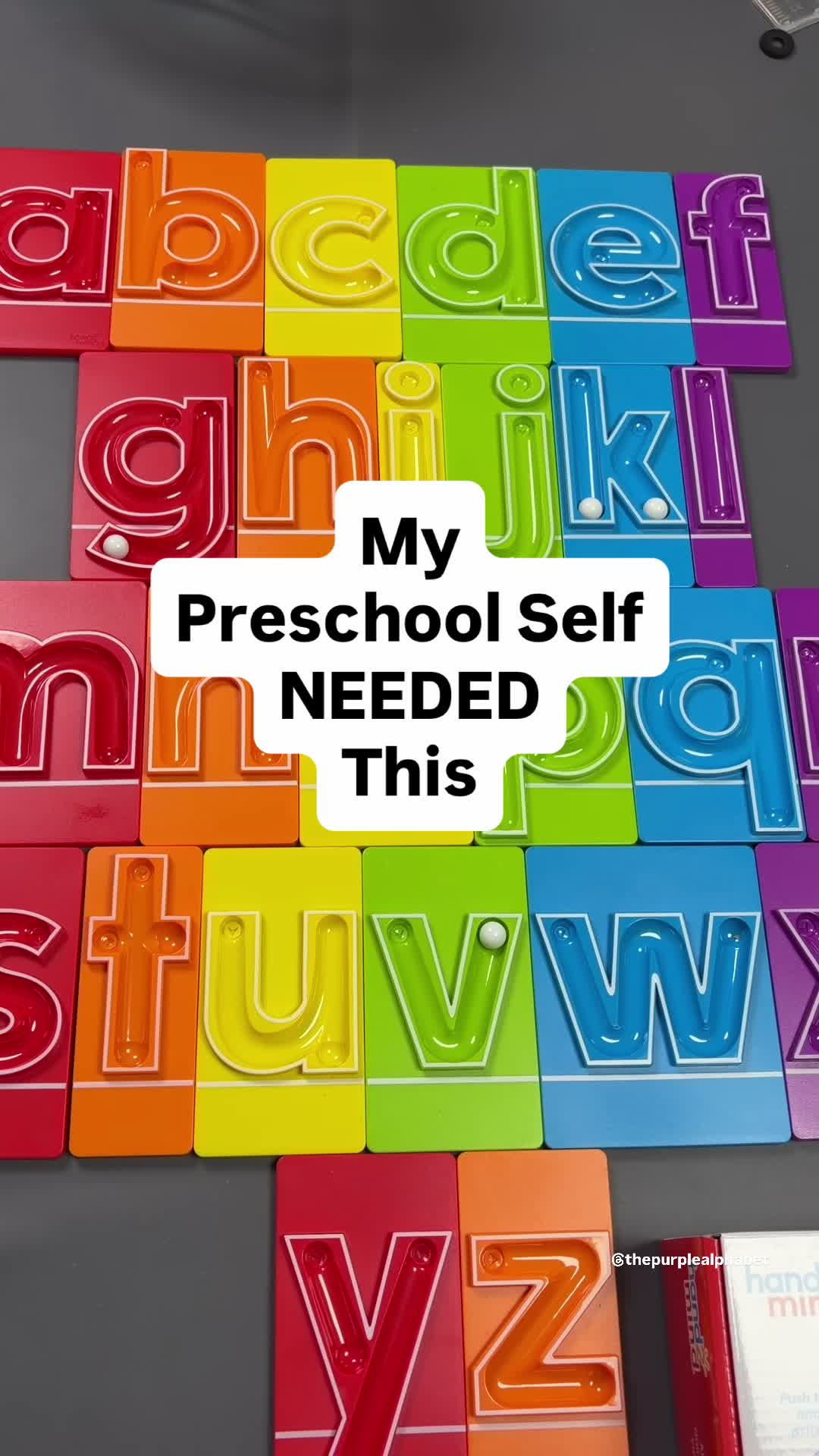 TikTok post by @thepurplealphabet for hand2mind. Caption reads: What a fun way to learn writing! @hand2mind has....