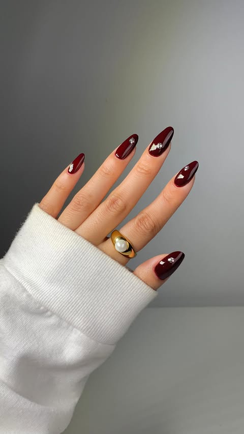 Instagram post by @glossytipped for essie. Caption reads: [...] to more glitter placement 🤭🍷💎using @essie....