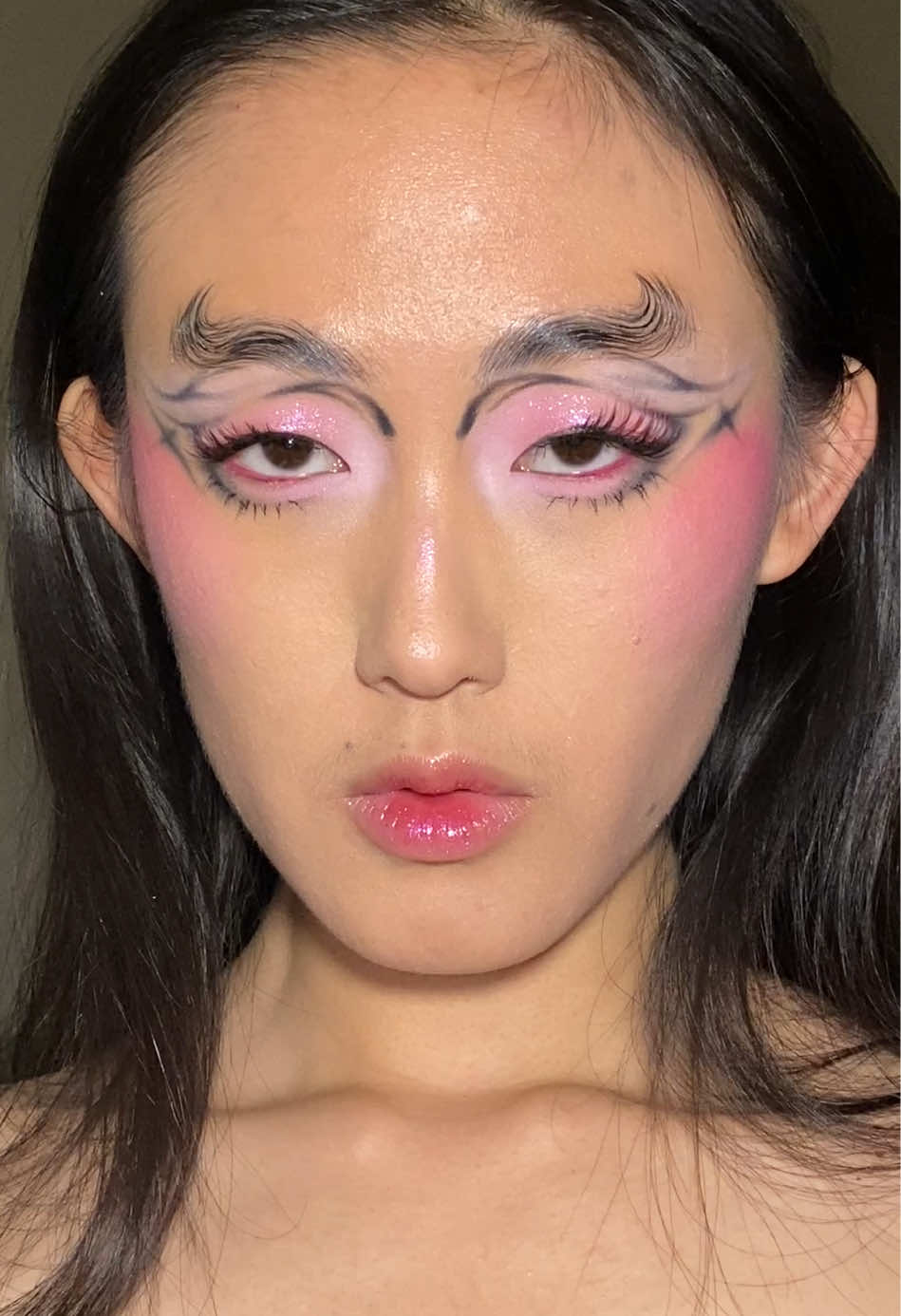 TikTok post by @hydronium for Lilac St. Caption reads: love these colors 🩷🖤 #creativemakeup....