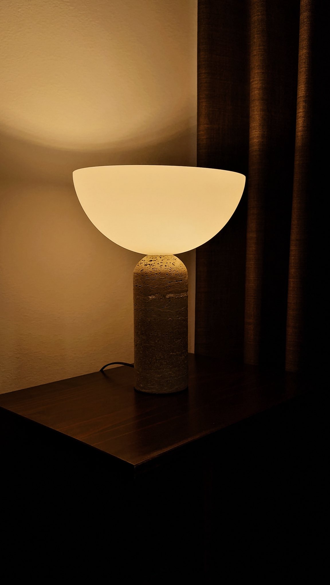 Instagram post by @neutral_homebody for Residence Supply. Caption reads: Added this travertine lamp from @residencesupply....