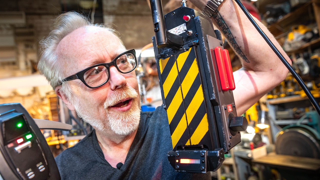 YouTube post by @tested for Hasbro Pulse. Caption reads: Adam Savage Unboxes Hasbro's Ghostbusters Ghost....