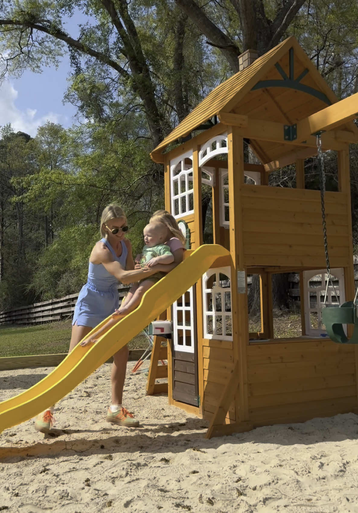 TikTok post by @caiitlynkiirkland for KidKraft. Caption reads: [...] out! We got the McKinley swingset from....