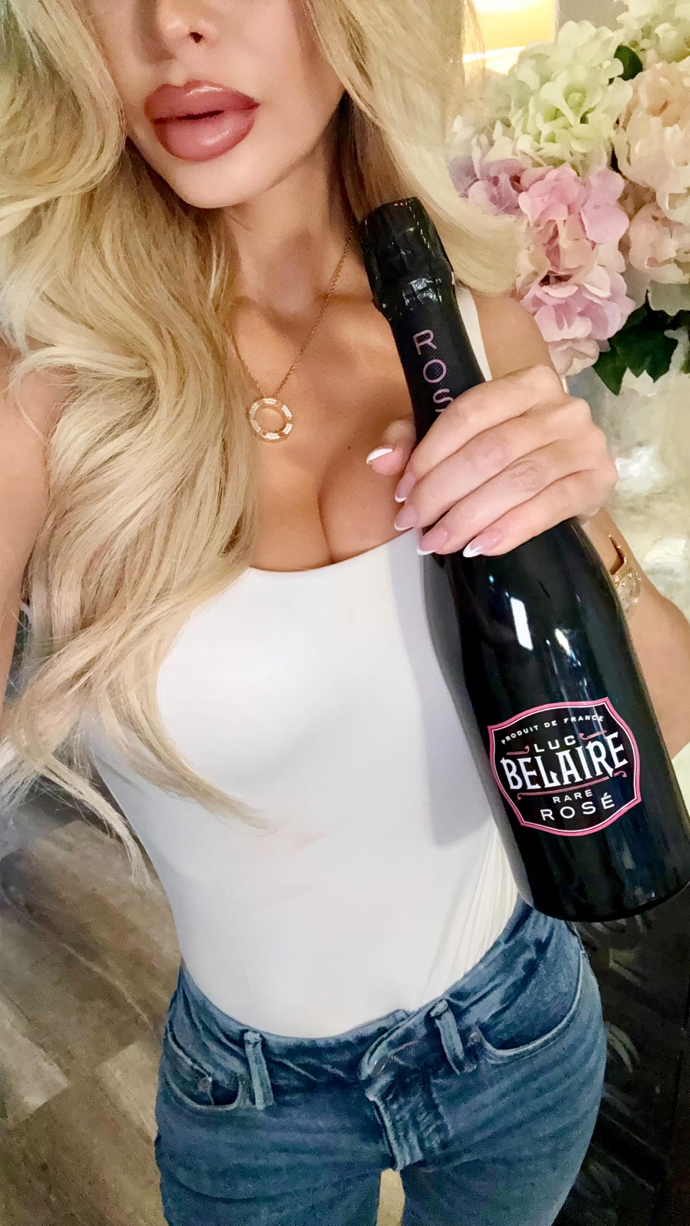 Instagram post by @kinadollxo for Luc Belaire. Caption reads: Celebrating my achievements this Father’s Day with....