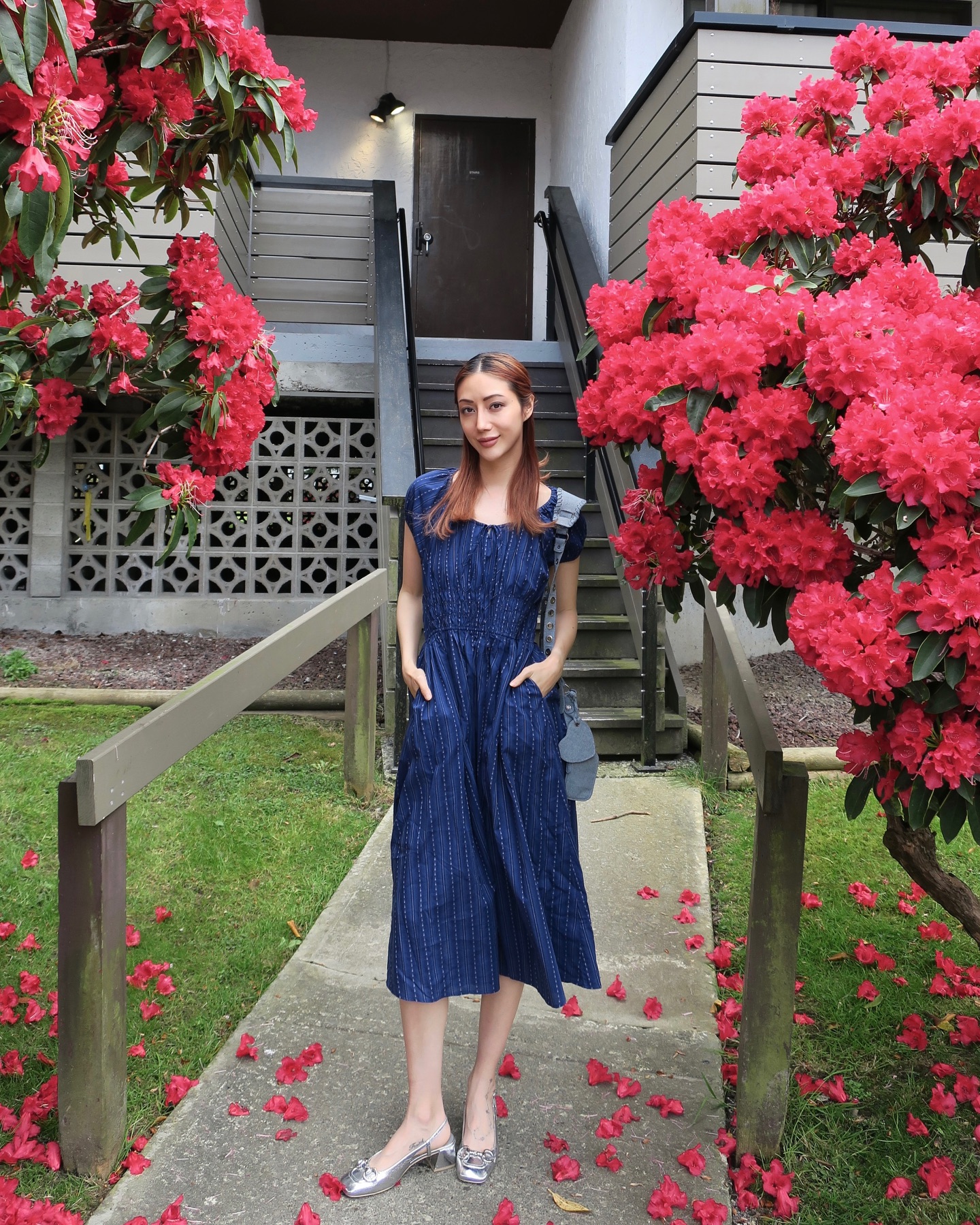Instagram post by @mel.zzie for Fashion Inspiration. Caption reads: Sundress season & spring blooms 🌺
I’m wearing....