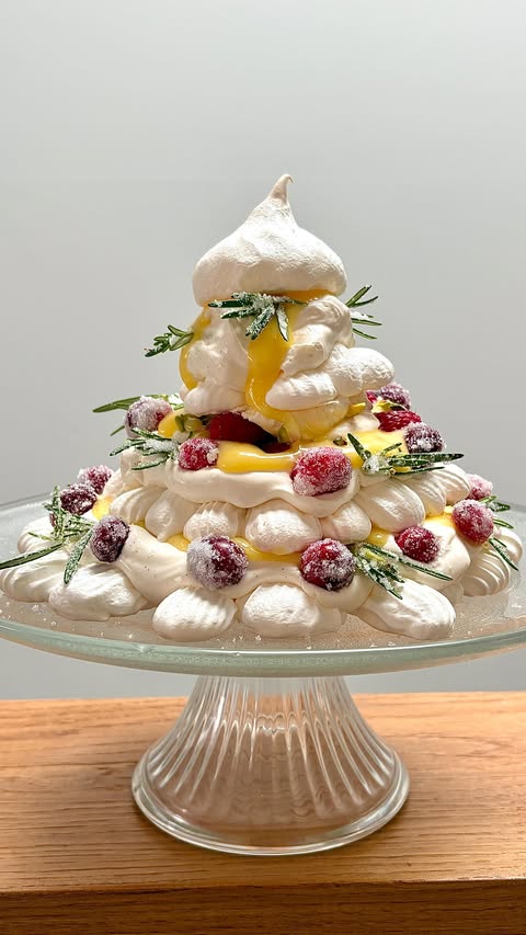 Instagram post by @jillian.barreca for Get Cracking. Caption reads: A Christmas tree pavlova! Festive, fruity and fun.....