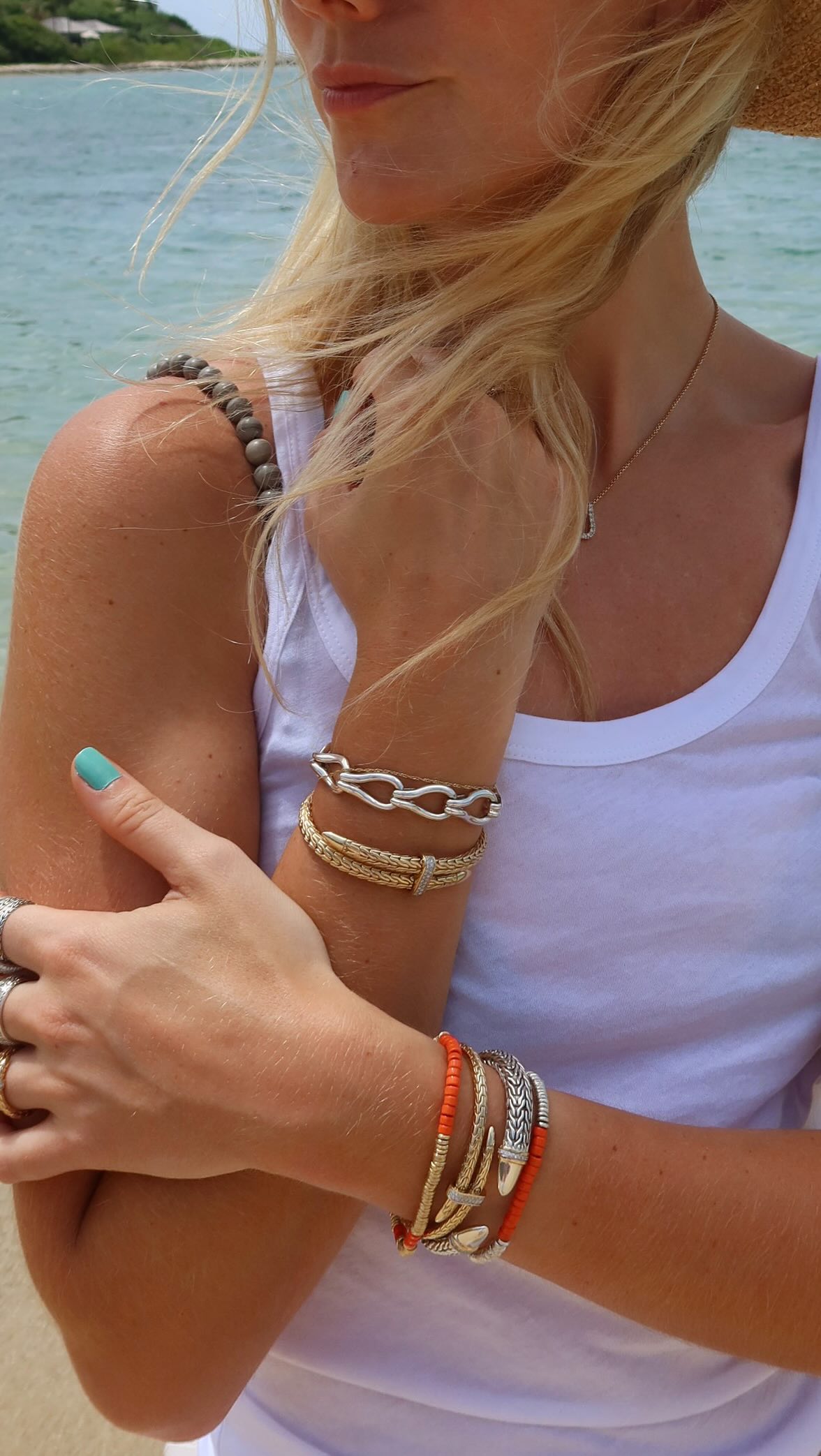 Instagram post by @lillysisto for John Hardy. Caption reads: stacking my @johnhardyjewelry #ad #JohnHardy.