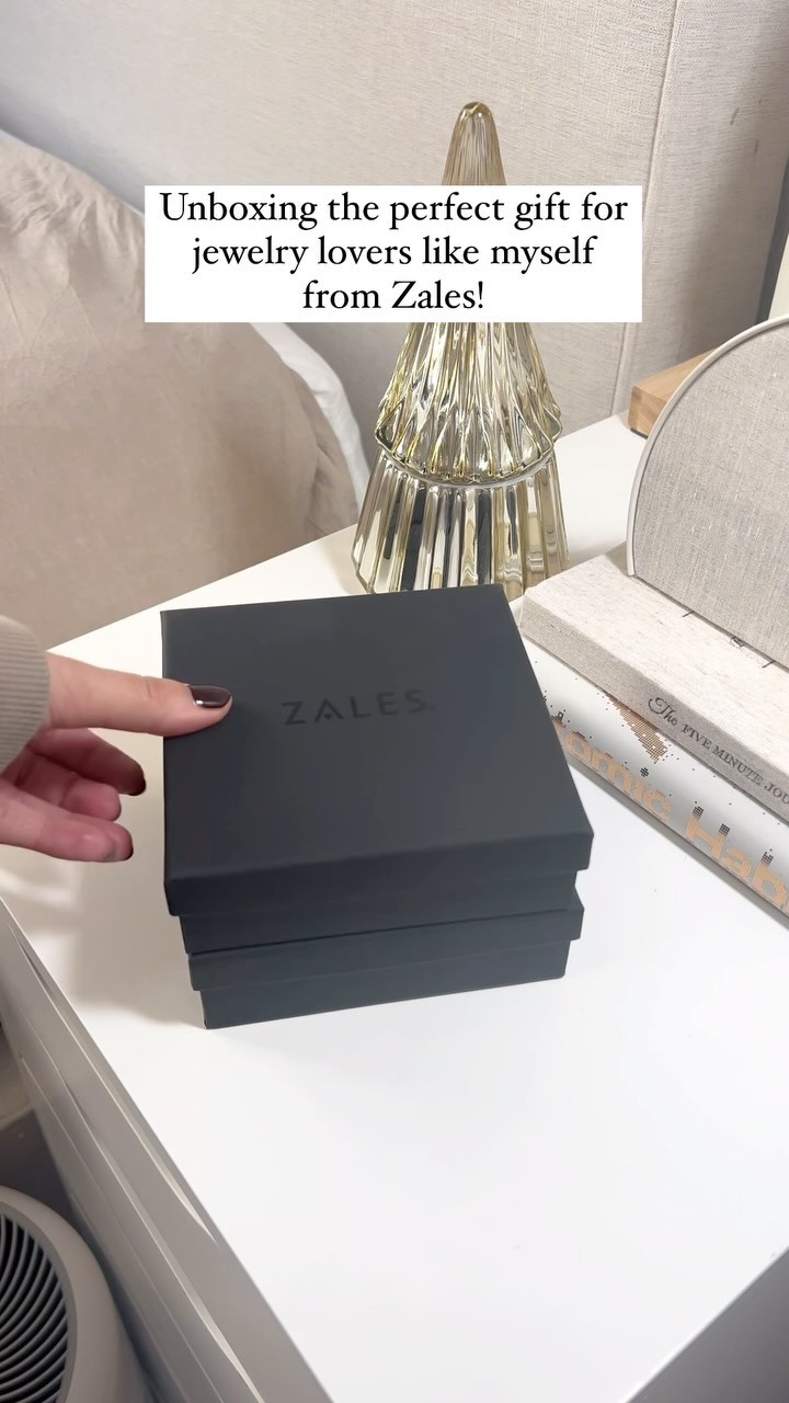 Instagram post by @elainamich for Zales. Caption reads: Unboxing the perfect holiday gift for a jewelry....