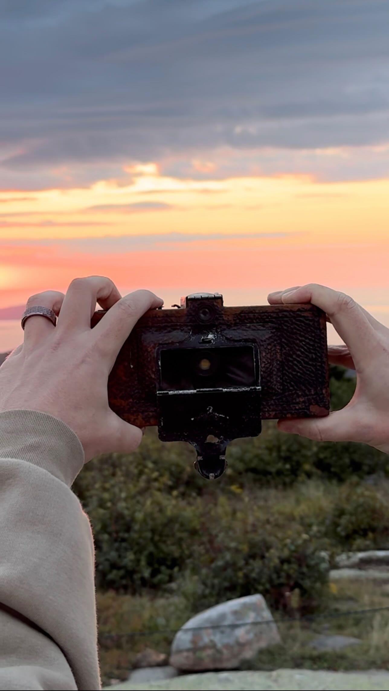 Instagram post by @expiredfilmclub for Visit Maine. Caption reads: Sunrise from the top of Cadillac Mountain in....