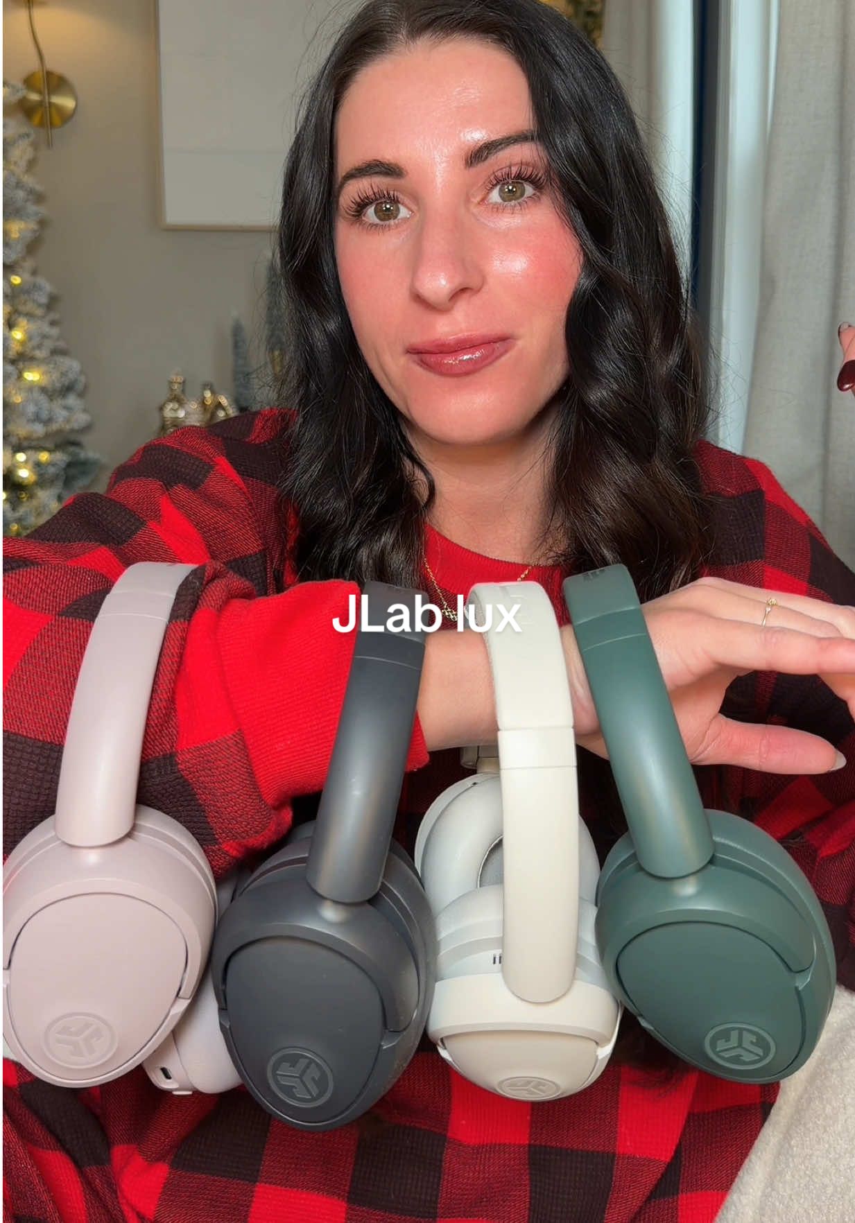 TikTok post by @kennyshopsalot for JLab. Caption reads: [...] up on these headphones 🎅🏼 @JLab #jlab....