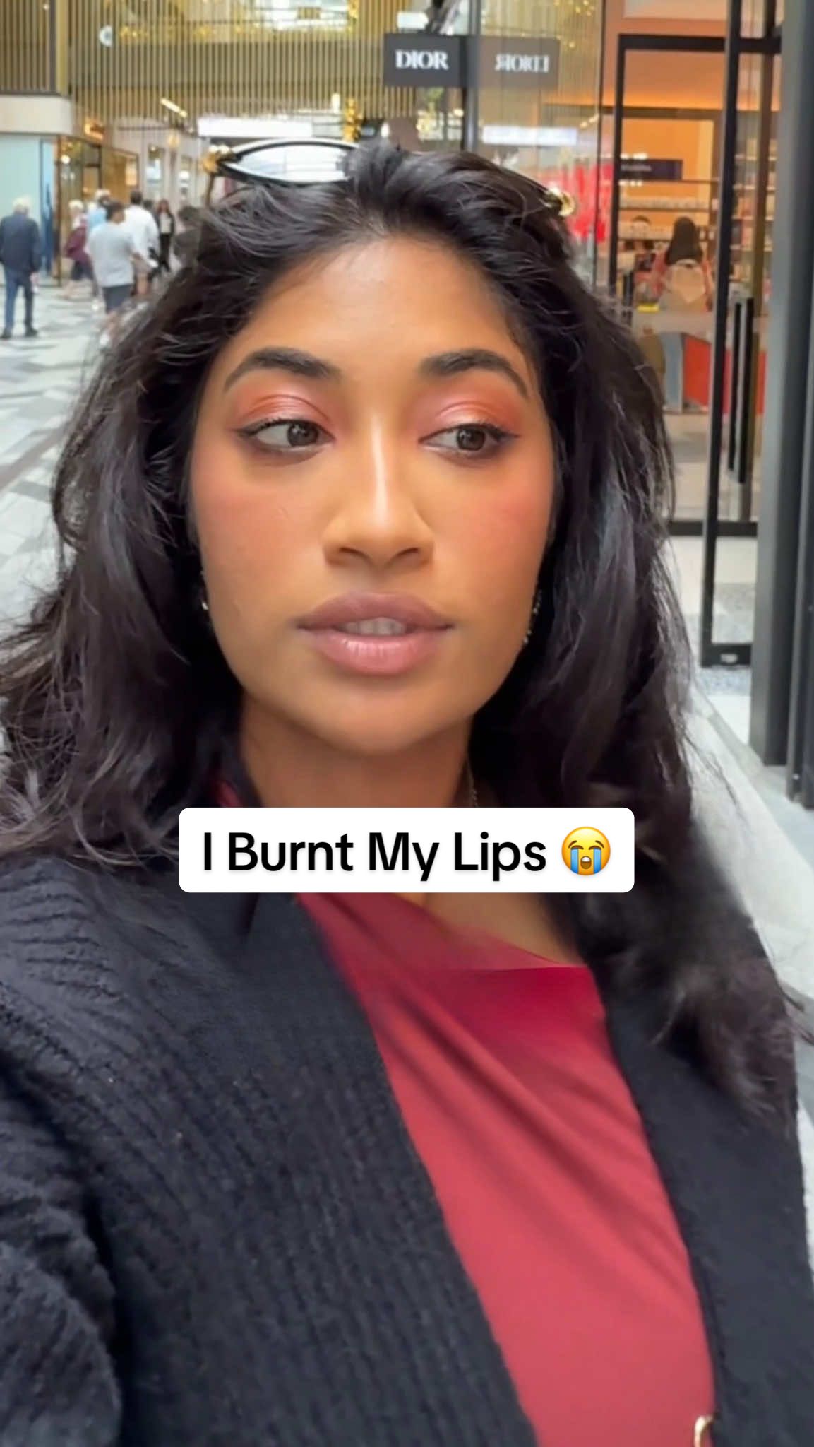 TikTok post by @monica.raviii for NAKED SUNDAYS. Caption reads: I burnt my lips because I forgot to bring spf....