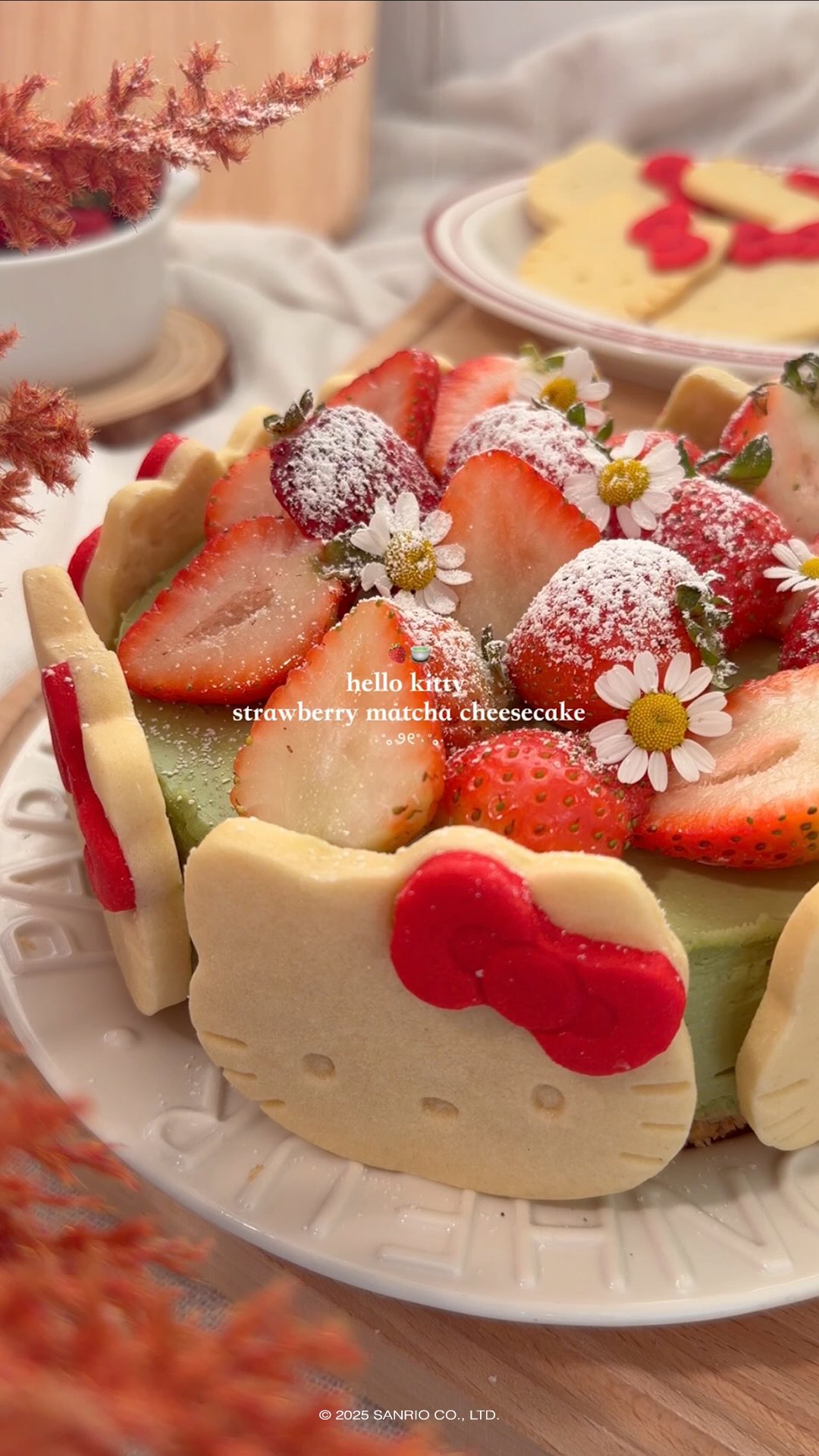 Instagram post by @may.kawaiikitchen for Hello Kitty. Caption reads: Hello Kitty Strawberry Matcha Cheesecake....
