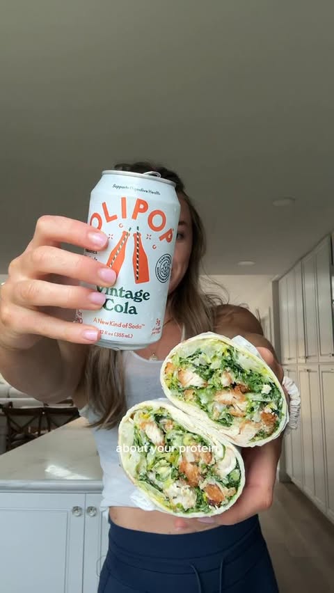 Instagram post by @avocado_bella for OLIPOP. Caption reads: caesal wraps with @drinkolipop . one of my go to....