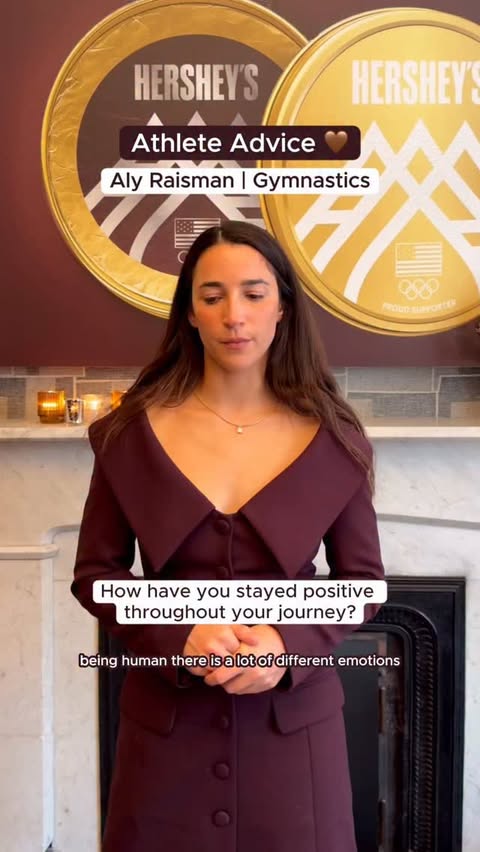 Instagram post by @alyraisman for HERSHEY'S Chocolate. Caption reads: Staying positive doesn’t mean every day is easy,....