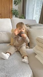 Instagram post by @shane.dmt for Les Petits Culottés. Caption reads: Baby Thiam’s outfit 🤎 

@viewy.fr....