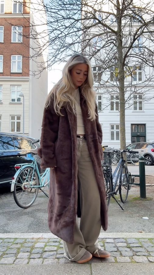 Instagram post by @albertekuske for Meotine. Caption reads: Wearing my new @meotine coat *ad*.