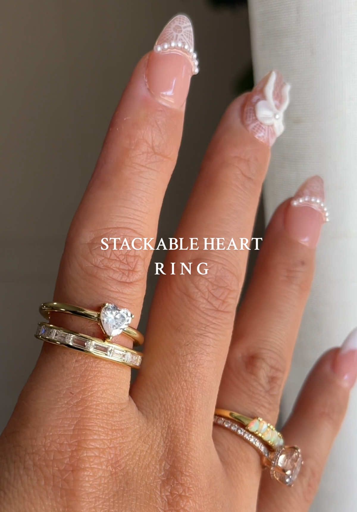 TikTok post by @vaneplyler for KissYan Jewelry. Caption reads: Affordable stackable rings! Love the heart stone....