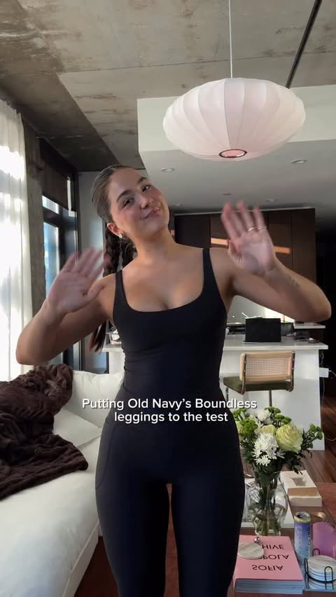 Instagram post by @caitlin.emiko for Old Navy. Caption reads: Putting @oldnavy new Boundless leggings to the....