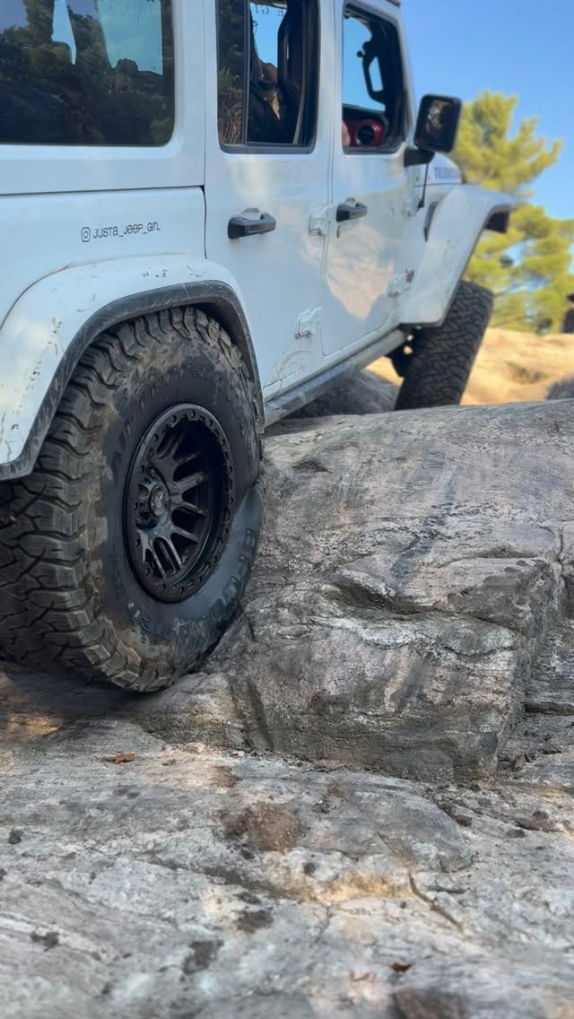 Instagram post by @justa_jeep_girl for BFGoodrich Tires. Caption reads: Jeep’s flexed out and the KO3s are gripping....