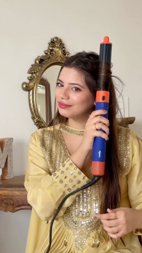 Instagram post by @mili_lakhmani for Dyson. Caption reads: [...] hair styles so here it is my best friend....