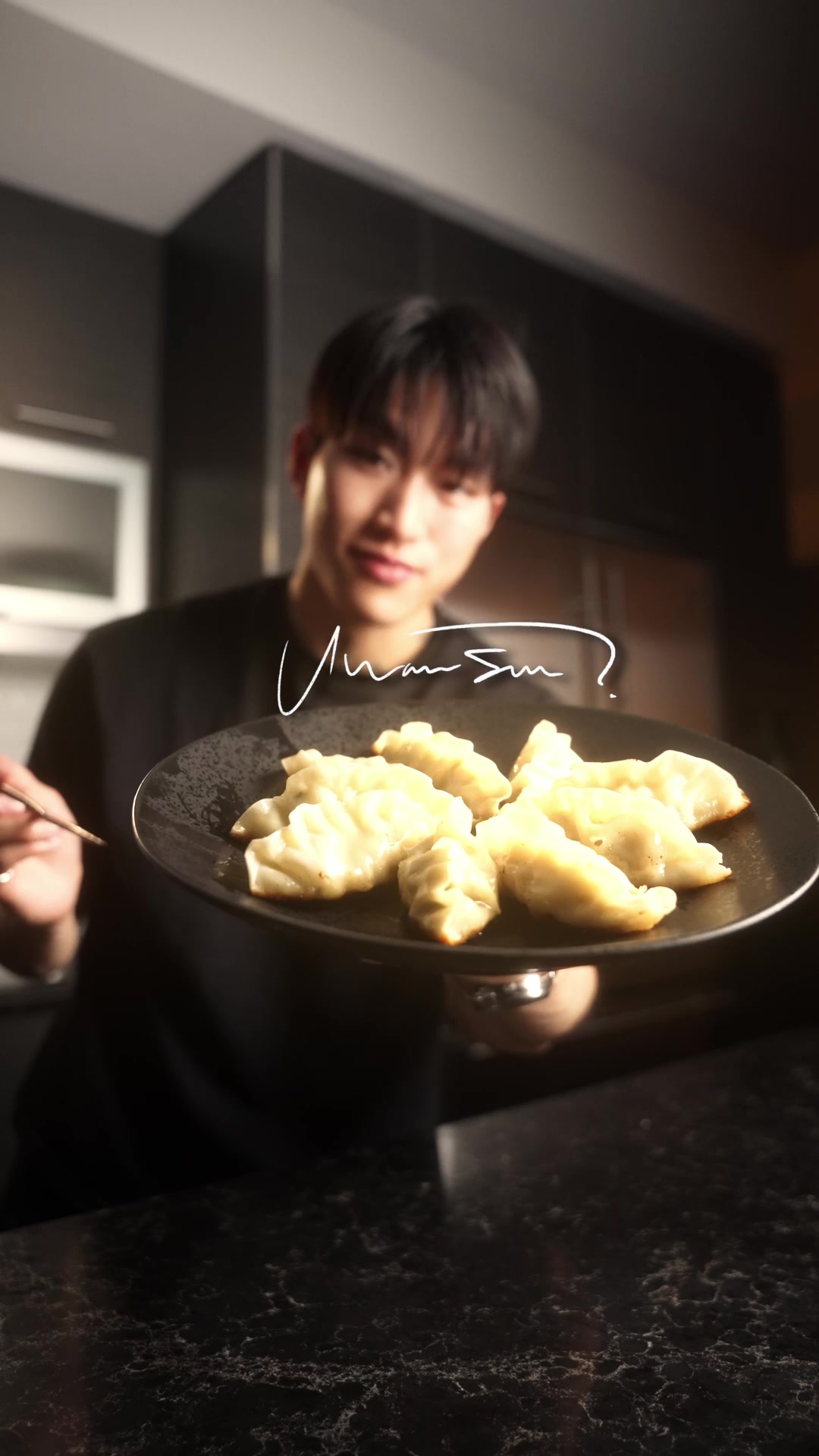 TikTok post by @kennylsong for bibigo USA. Caption reads: [...] for me 🥹 love the dumplings from @bibigo....