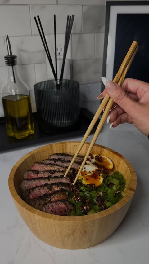 Instagram post by @carlyycamilla for Whole Foods Market. Caption reads: High Protein Creamy Steak Ramen🌶️🍜 (62g....