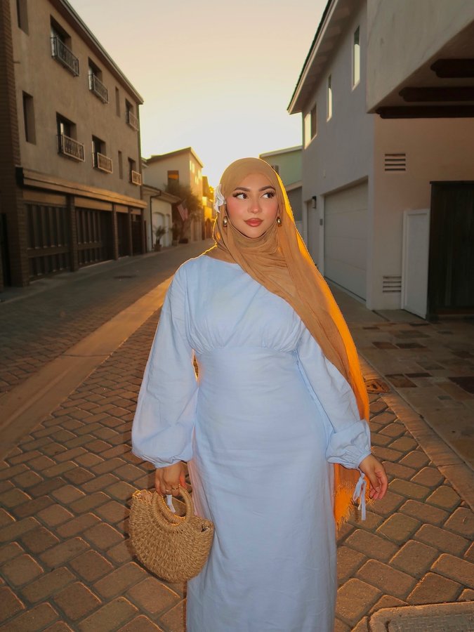 Instagram post by @nashitasultana for Veiled. Caption reads: see you at sunset 🌊💌☀️

Hijab is....