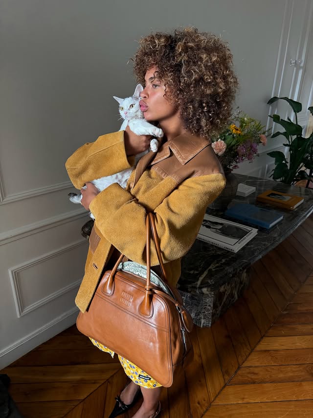 Instagram post by @paolalct for Miu Miu. Caption reads: caught a feeling for this bag ngl @miumiu #MiuMiu....